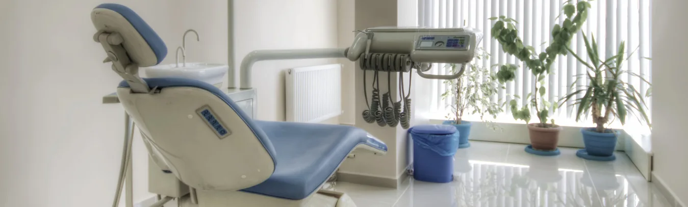 A treatment room at Orion Dental Clinic with a dental chair beside a window
